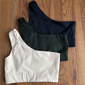 Girlfriend Collective One-Shoulder Crop Tops - Black, Dark Green, and Cream